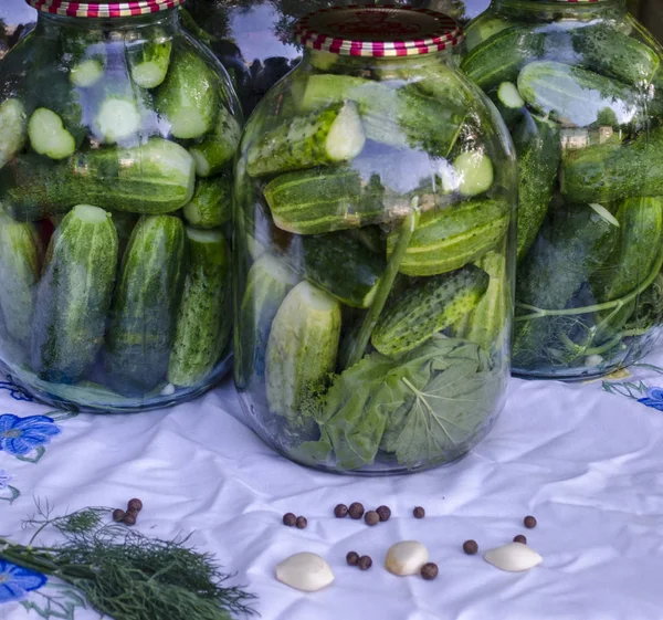 Pickled cucumbers in glass jar. Preservation of cucumbers for the winter.