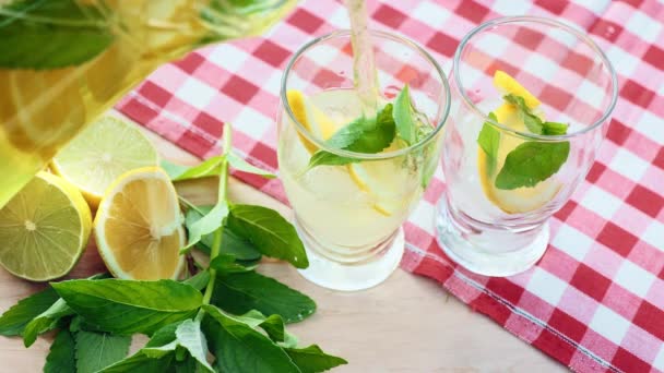 Slow Motion Lemonade Poured Decanter Two Glass Cup Mint Ice — Stock Video