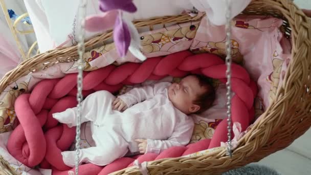 Cute newborn baby sleeping in cradle — Stock Video