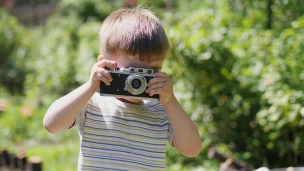 Portrait Lovely Little Boy Taking Pictures Outdoors Vintage Camera Slow — Stock Video