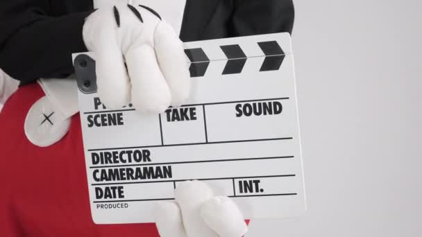 Hands with movie production clapper board, on white — Stock Video