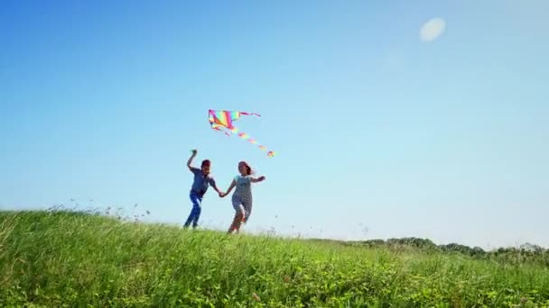 Child boy and girl enjoy walking with flying kite — Stock Video