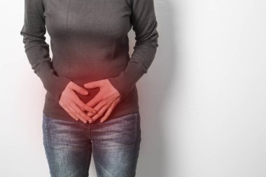 A woman has pain in the urea during menstruation, period. Bowel spasm. Diarrhea.  clipart
