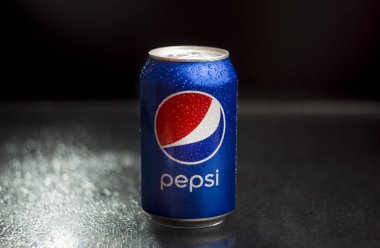 Kiev, Ukraine - Aug 5th, 2019:  Tin can of Pepsi drink on a black background.