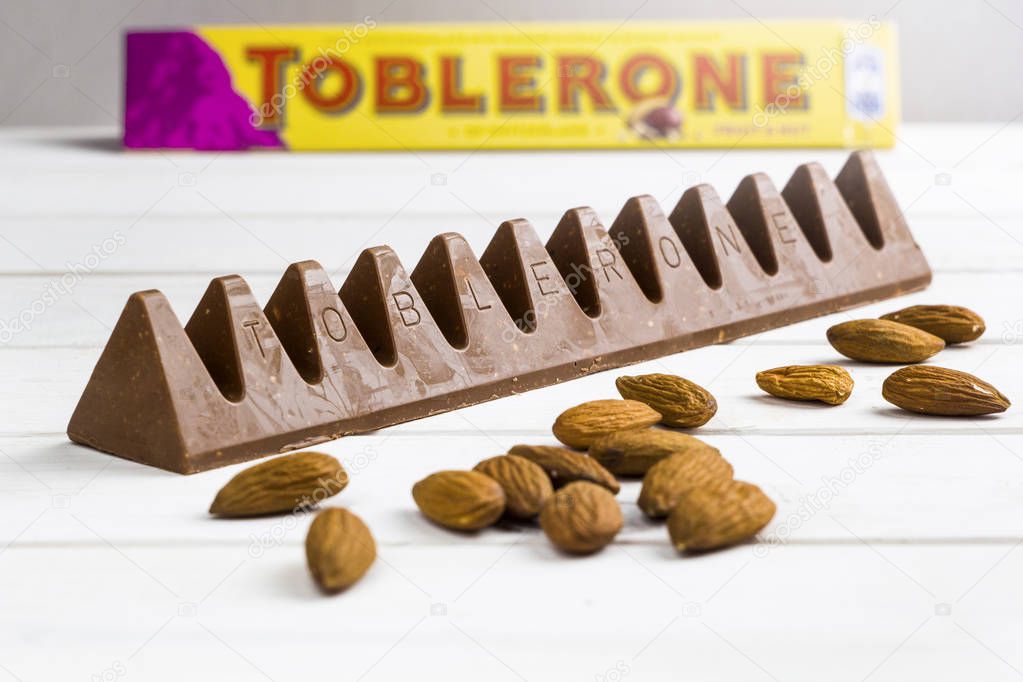 KIEV, UKRAINE - AUGUST 18, 2019: Toblerone - Swiss milk chocolate with raisins, honey and almond nougat.