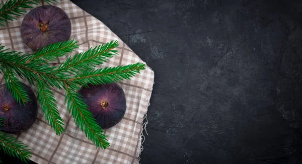 rice on a dark background. figs on concrete. side view