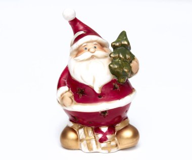 Sevimli Noel baba bebek. Çok güzel Noel Baba dekoratif oyuncak, yalıtkan beyaz zemin üzerinde. Noel ve yeni yıl sembolleri.