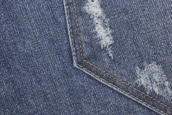 Tessitura jeans blu strappato denim. Sfondo astratto jeans sbiaditi. sfondo per il design . — Foto Stock