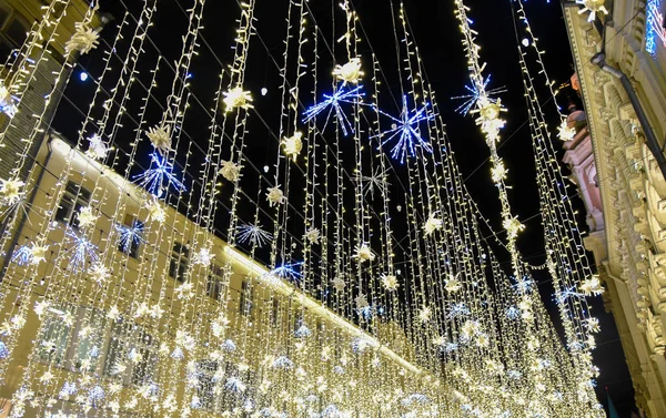 New year\'s bright Golden garland on the street in Moscow night