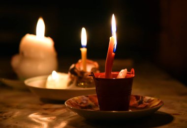 divination ritual a few different candles in the night clipart
