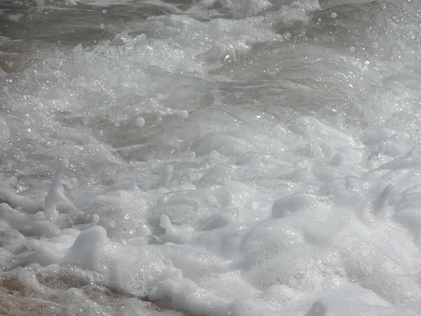Plný rám bílé mořské pěny jako pozadí. — Stock fotografie