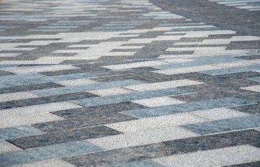 Arka plan olarak tam kare gri sokak fayansı. Tasarım için soyut arkaplan, metin için kopyalama alanı.