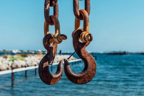 Two Rusty Iron Hooks on the chains — Stock Photo, Image