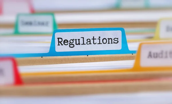 File Folders Tab Labeled Regulations — Stock Photo, Image