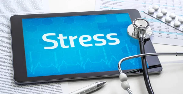 La palabra estrés en la pantalla de una tableta —  Fotos de Stock