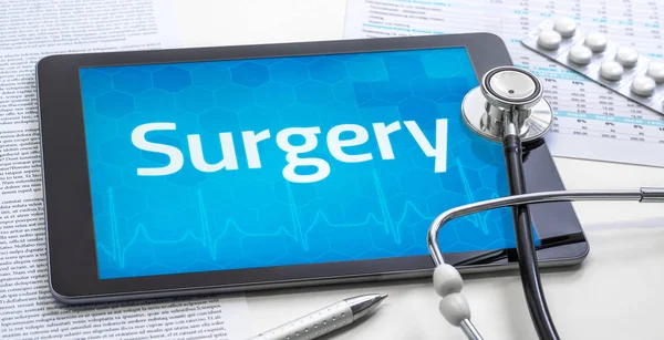 The word Surgery on the display of a tablet — Stock Photo, Image