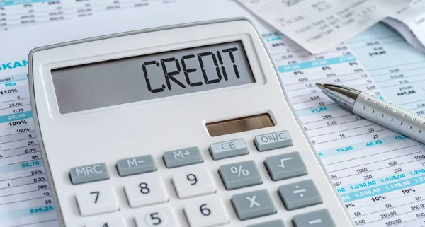 Una calculadora con la palabra Crédito en la pantalla —  Fotos de Stock