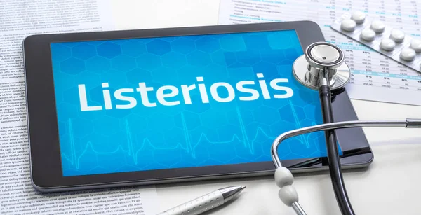 The word Listeriosis on the display of a tablet — Stock Photo, Image