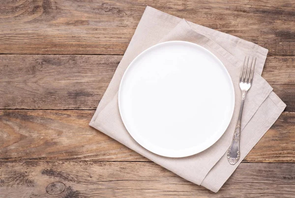 Empty White Plate Napkin Silver Fork Old Wooden Table Top — Stock Photo, Image