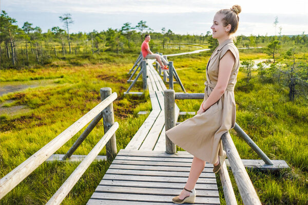 selective focus of woman and boyfriend standing on wooden with green plants around