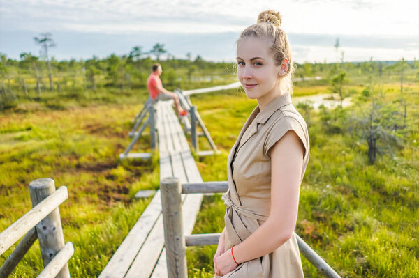 selective focus of woman and boyfriend standing on wooden with green plants around