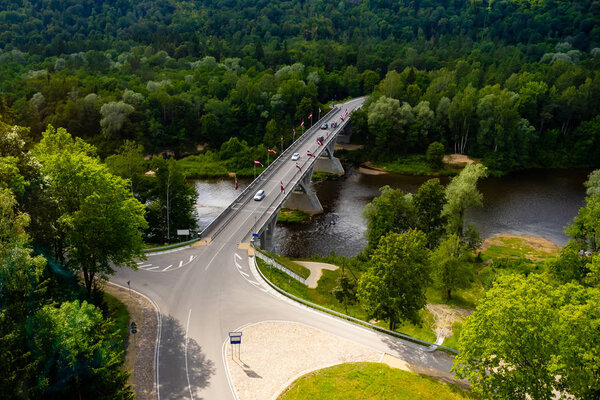 aerial view of road with green trees around, Riga, Latvia
