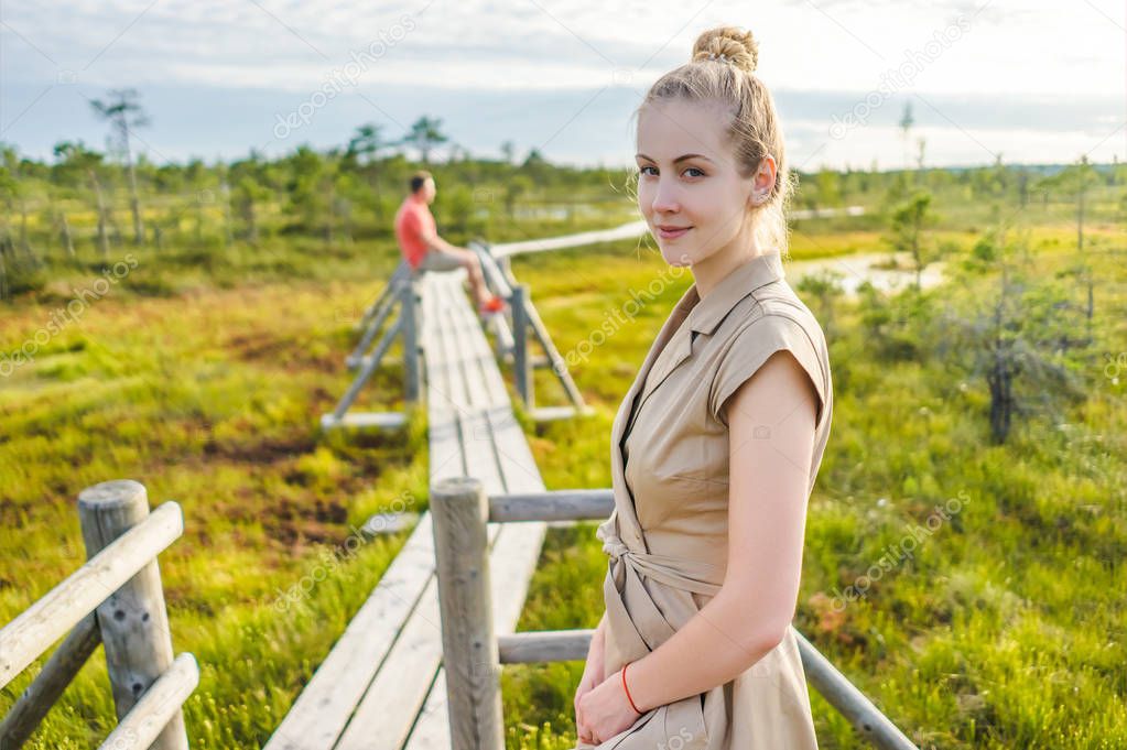 selective focus of woman and boyfriend standing on wooden with green plants around