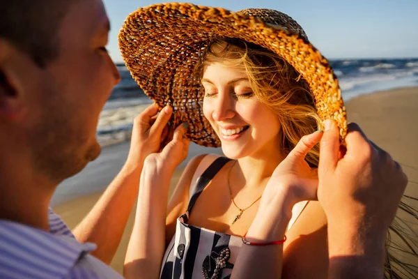 Smiling couple in love on seashore on summer day in Riga, Latvia — Stock Photo