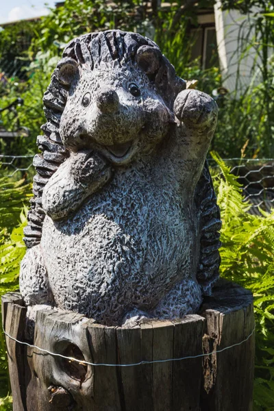 Beautiful little garden statue of a waving hedgehog in germany