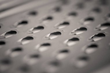 ayrıntılı monocrome makro çekim bir metal Peynir rende, mutfak