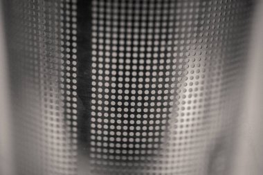 monocrome macro shot of a metal tea strainer sieve, kitchen clipart