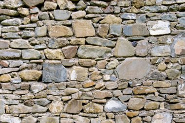 Taş duvar dokulu renkli taşlarla