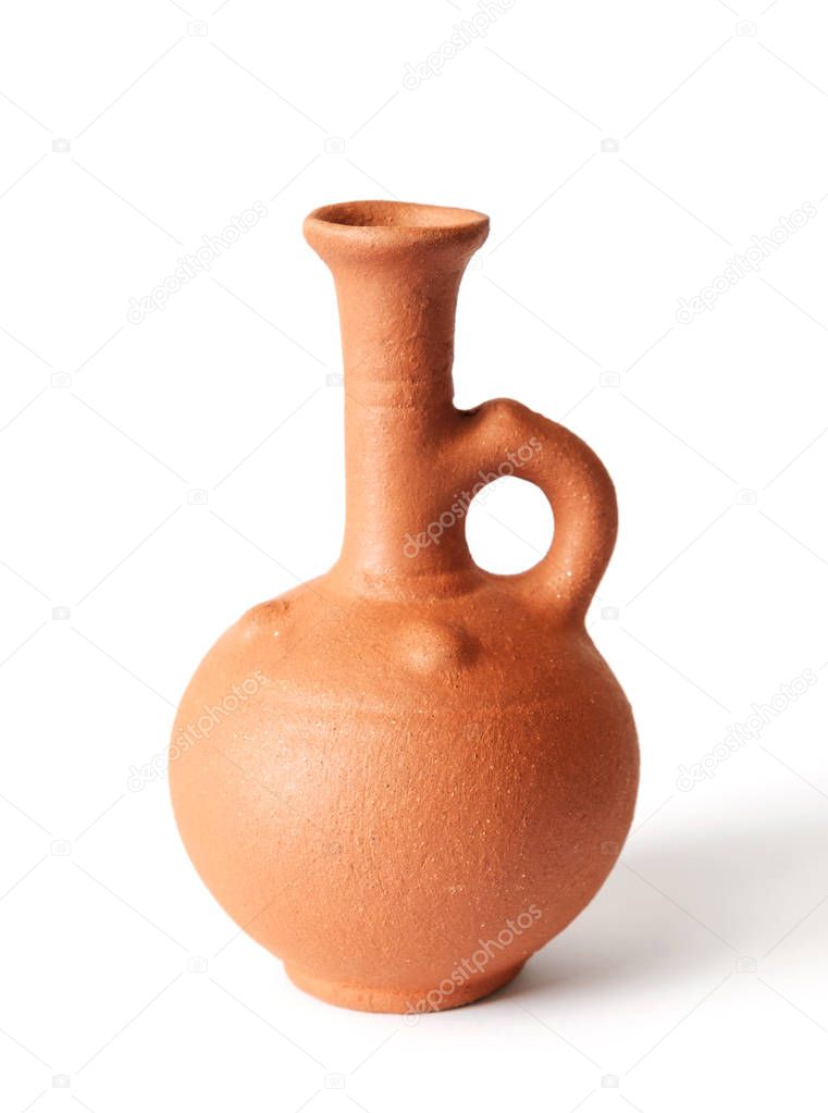 A clay wine jug on a white background, isolated