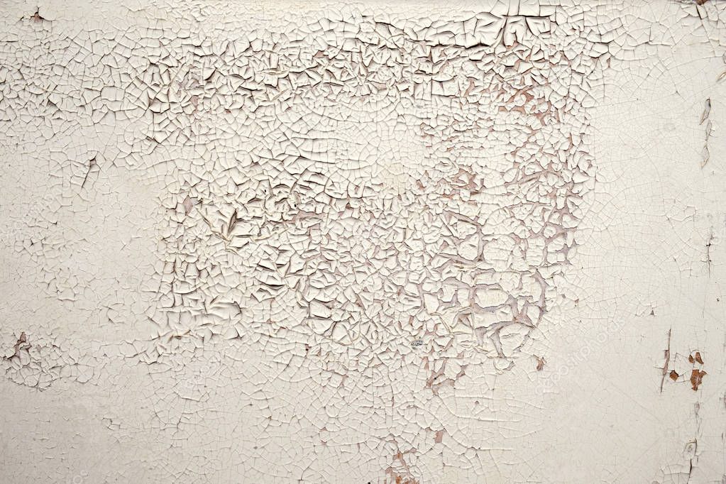 A vintage white cracked shabby wall texture