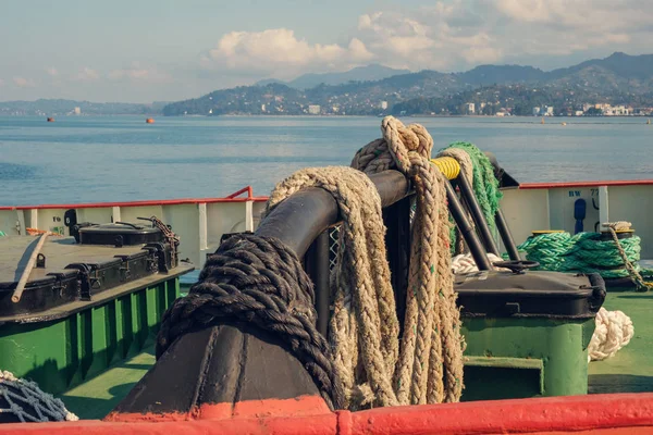 Ropes on the ship, sea and mountains background