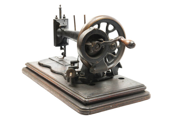 Classic vintage style manual sewing machine on a white background, isolated
