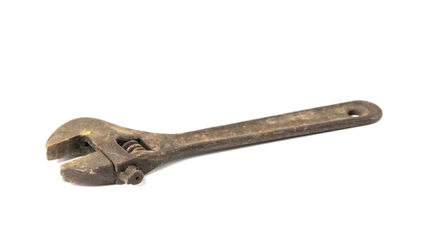 Старый ржавый регулируемый ключ — стоковое фото