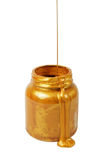Derramando tinta dourada na lata — Fotografia de Stock