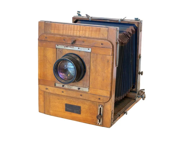 Old vintage wooden camera with lens Stock Image