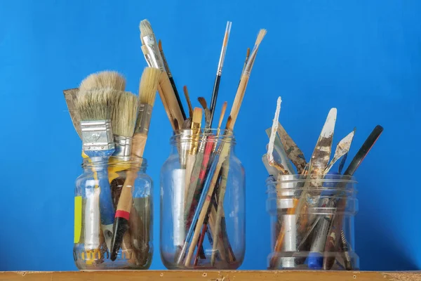 Paint Brushes Painting Equipment Glass Jars Art Equipment Blue Background — Stock Photo, Image