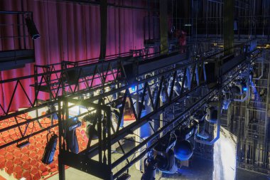 Technical equipment at the backstage of theater. Stage spot lighting rigging structure for a live musical theater events clipart