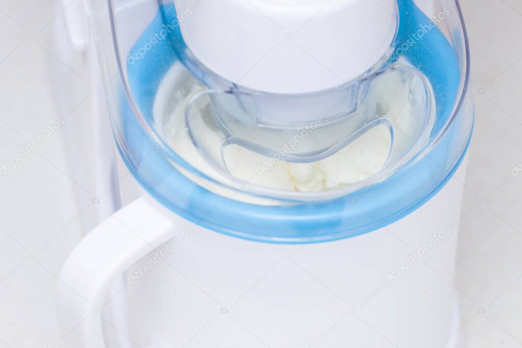 Ice cream maker machine tool with white vanilla ice cream.
