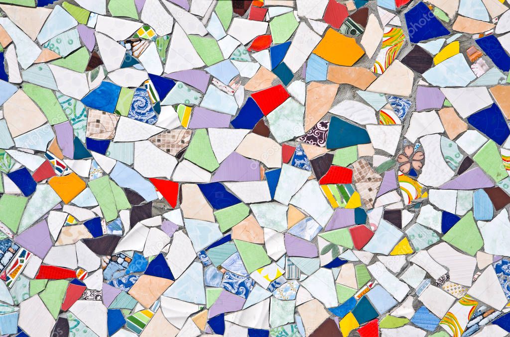The original background created from multicolored pieces of broken tiles. Mosaic.