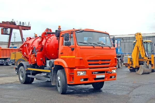 Industrial cars. Sewage/septic trucks, bulldozer. Russia.