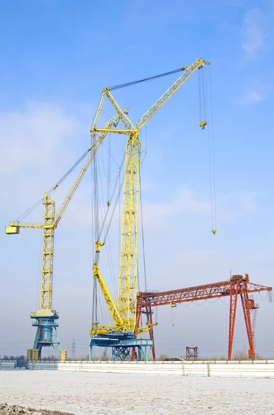 Sevefal tower cranes. gantry cranes against the blue sky. Russia