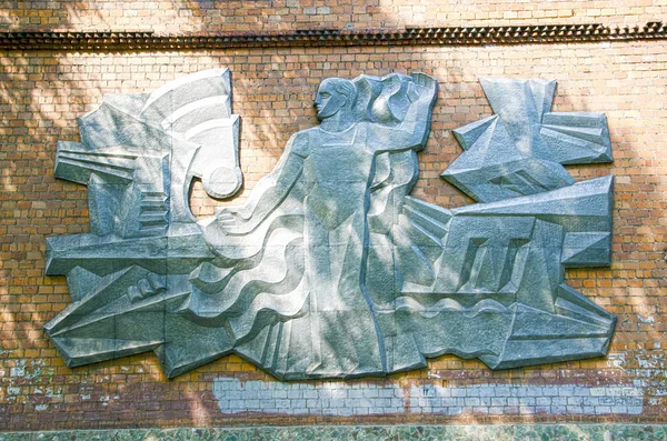 Soviet worker. Metal embossing on the wall on the wall of the old, Soviet stadium. Remained only in the photo. The house is demolished.