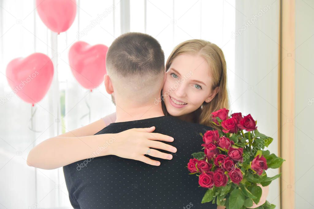 Love Couple giving Rose flower in bedroom happiness in love Valentine's day concept
