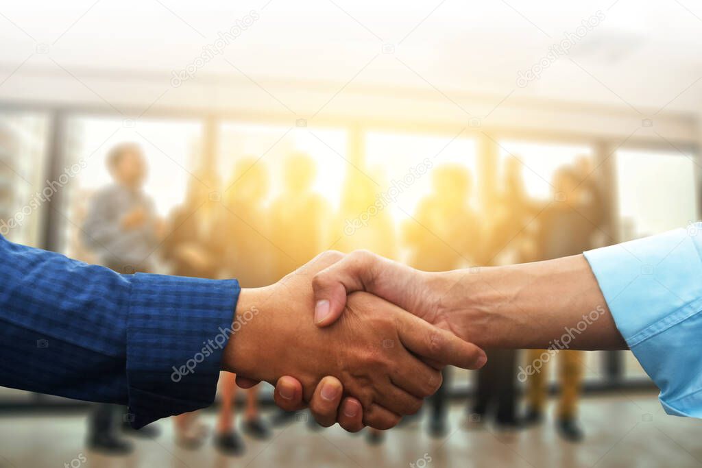 Shake hands Business people teamwork group are happy finished success business project standing in office congratulation