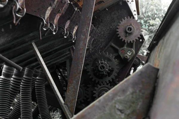 Rusty and grungy rural technical device background with visible different parts