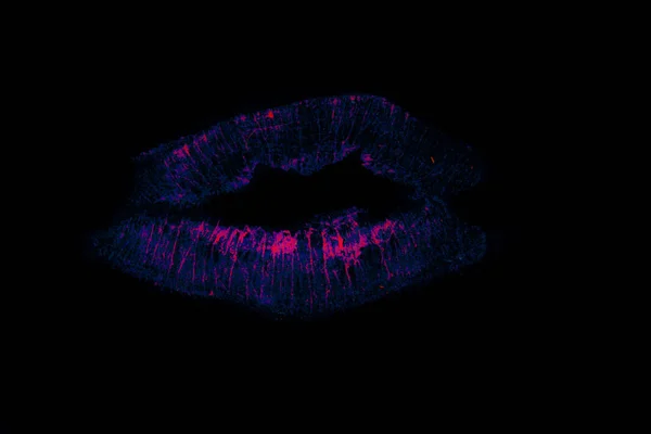 Blue lips with flowing luminous pink lipstick prints on black background surface